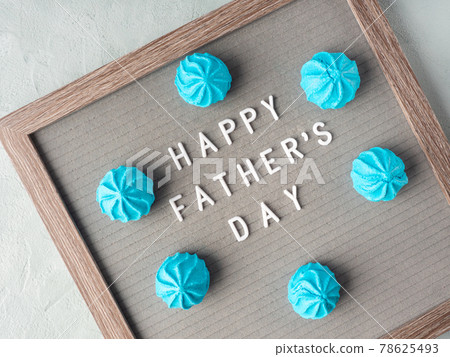 Happy fathers day greeting card with letter board and blue meringues Happy fathers day greeting card with letter board and blue meringues 78625493