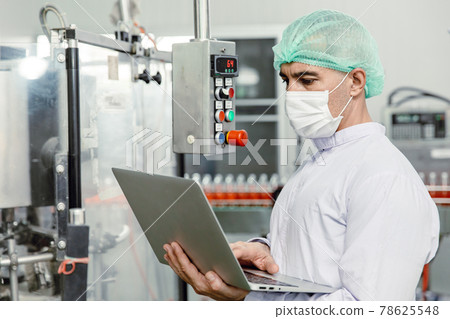 engineer working with laptop in food factory machine production inspector with hygiene clothes. engineer working with laptop in food factory machine production inspector with hygiene clothes. 78625548