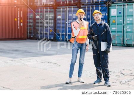 logistic worker man and woman working team with radio control loading containers at port cargo to trucks for export and import goods. logistic worker man and woman working team with radio control loading containers at port cargo to trucks for export and import goods. 78625806