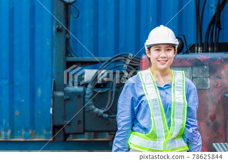 Portrait of Asian young teen happy smile worker working in shipping port manage import export cargo containers. Portrait of Asian young teen happy smile worker working in shipping port manage import export cargo containers. 78625844