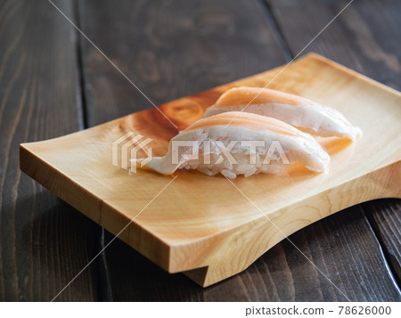 Toro salmon nigiri sushi. Japanese sushi on wooden sushi clogs. Toro salmon nigiri sushi. Japanese sushi on wooden sushi clogs. 78626000