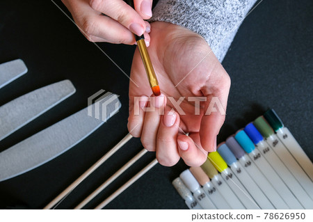 Work at home with nails. Nail care, Self care. Female manicure. Do manicure by yourself while staying at home. Female hands and manicure tools 78626950