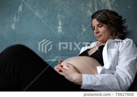 Pregnant caucasian woman touching her belly. Waiting for baby 78627808