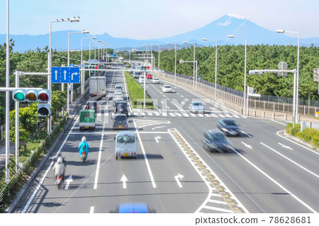 Mount Fuji and a car running on the road 78628681