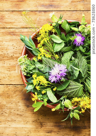 Natural medicine,fresh herbs on wooden table 78628860