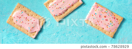 Pop tarts, shot from above on a blue background Pop tarts, shot from above on a blue background 78628929