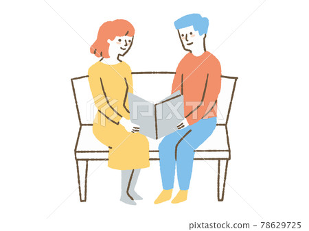 Two men and women reading a book Two men and women reading a book 78629725