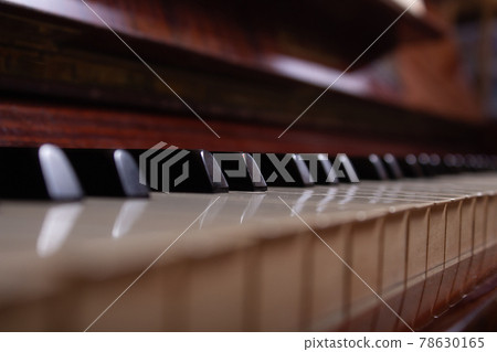Close up of black, white piano keys. 78630165