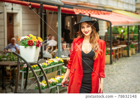 Woman is posing in the city street 78632148