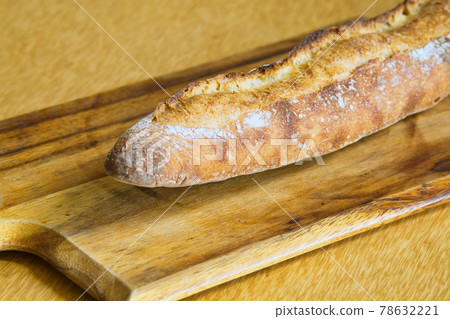 French bread on a cutting board French bread on a cutting board 78632221