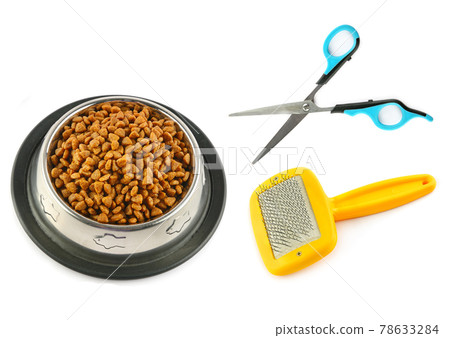 Dry pet food, scissors and hairbrush isolated on white . Dry pet food, scissors and hairbrush isolated on white . 78633284