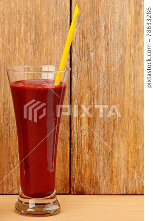 Blueberry, raspberry and strawberry smoothie on wooden table. Blueberry, raspberry and strawberry smoothie on wooden table. 78633286