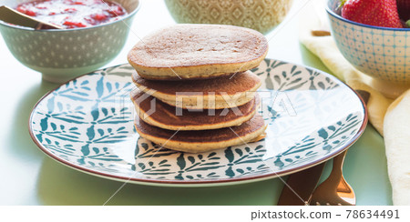 Vegan gluten free banana buckwheat pancakes served with dairy free yogurt and chia strawberry jam 78634491