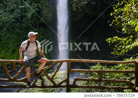Tourist at the La Fortuna Waterfall in Costa Rica Tourist at the La Fortuna Waterfall in Costa Rica 78635729