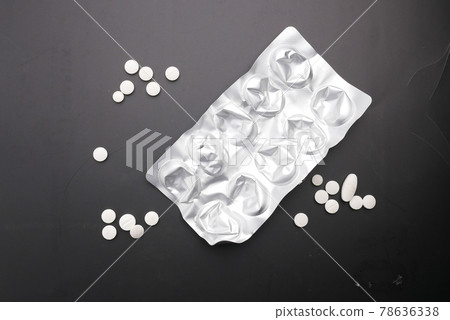 Close up of pills of blister pack on black background Close up of pills of blister pack on black background 78636338