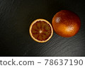Close up of blood orange on a black plate 78637190
