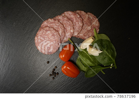 Italian pizza ingredients tomato basil garlic paprika salami pepper 78637196
