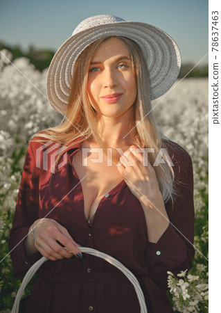 woman in a blooming field 78637463