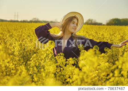 woman in a blooming field 78637487