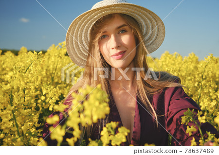 woman in a blooming field woman in a blooming field 78637489