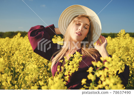 woman in a blooming field 78637490