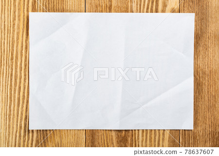 Flat lay wooden table with paper sheet Flat lay wooden table with paper sheet 78637607