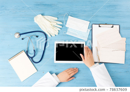 Top view of doctor hands with tablet computer Top view of doctor hands with tablet computer 78637609