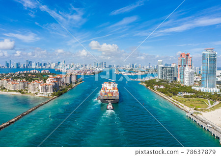Large Container Ship Entering Harbor and Miami City on Sunny Day, USA. Aerial View 78637879