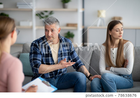 Unhappy mature couple having meeting with marital counselor, discussing relationship problems 78638676