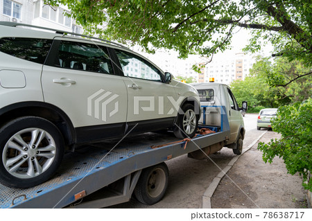 car is transported on tow truck.transporting cars after accidents and breakdowns car is transported on tow truck.transporting cars after accidents and breakdowns 78638717