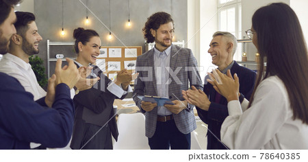 Team of thankful business people applauding a speaker for his presentation in a meeting Team of thankful business people applauding a speaker for his presentation in a meeting 78640385