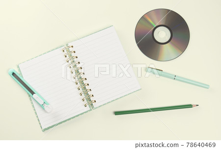 flat lay green color stationery and CD 78640469