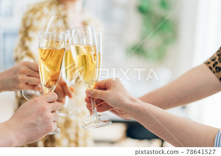 Young men and women toasting Young men and women toasting 78641527