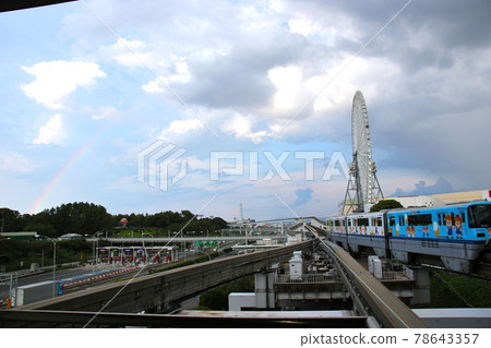 Osaka Monorail 1000 series 25 trains bound for Osaka Airport entering Osaka Monorail Expo Memorial Park Station against the backdrop of the rainbow sky Osaka Monorail 1000 series 25 trains bound for Osaka Airport entering Osaka Monorail Expo Memorial Park Station against the backdrop of the rainbow sky 78643357