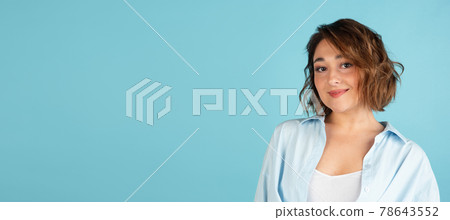 Flyer. Young Caucasian beautiful woman in casual clothes isolated on light blue background. Flyer. Young Caucasian beautiful woman in casual clothes isolated on light blue background. 78643552