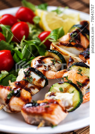 Fish skewers with mixed salad. High quality photo. 78643787