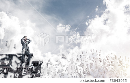 Young man on building edge dont want to hear anything Young man on building edge dont want to hear anything 78643955