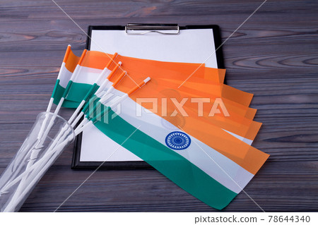 Collection of indian flags on the clipboard with blank paper. 78644340