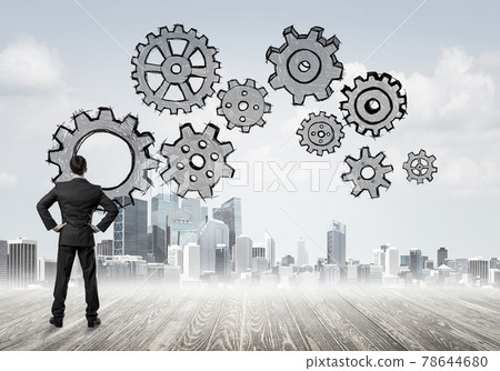 Cogwheel engine drawn on screen as symbol for teamwork and coope 78644680