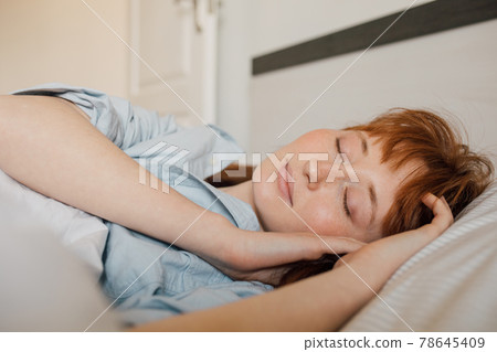 Lady resting and sleeping in her bedroom at the morning Lady resting and sleeping in her bedroom at the morning 78645409