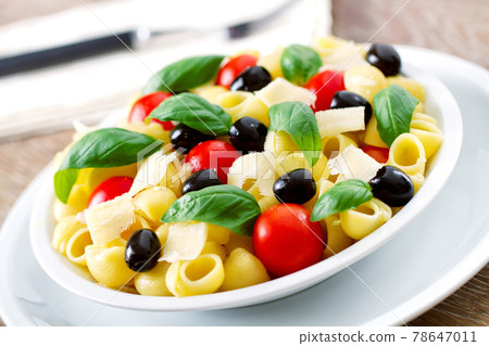 Fresh Pasta Salad with Tomatoes and Black Olives. High quality photo Fresh Pasta Salad with Tomatoes and Black Olives. High quality photo 78647011