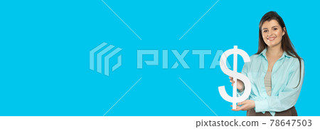 The girl holds a large dollar symbol in her hands. The shape of the US currency. Symbol of finance and cash flow in the economy and the stock market on a blue background. Panoramic frame. 78647503