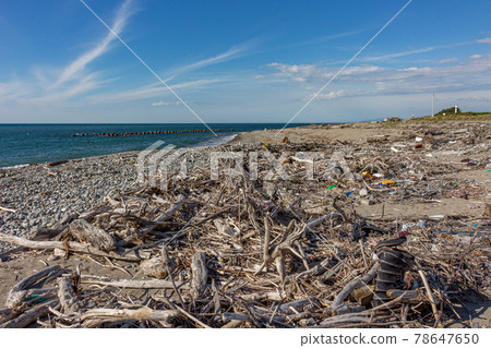 Trash from Japan Sea, washed up on the beach at Mikawa, Japan. Trash from Japan Sea, washed up on the beach at Mikawa, Japan. 78647650