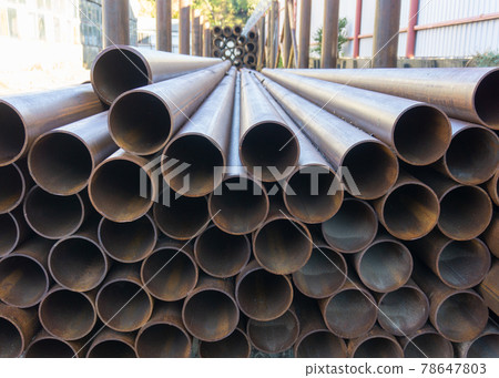 A bunch of large metal pipes. A bunch of large metal pipes. 78647803