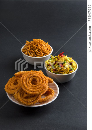 Indian Snack : Chakli, chakali or Murukku and Besan (Gram flour) Sev and chivada or chiwada. Diwali Food 78647932