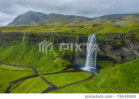 Aerial view of Seljalandsfoss - most famous best known and visited waterfalls in Iceland. Aerial view of Seljalandsfoss - most famous best known and visited waterfalls in Iceland. 78648069