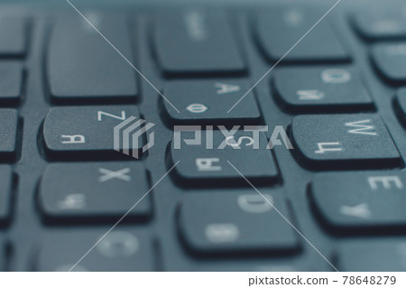 Closeup black keyboard with Ukrainian and English alphabet layout. Closeup black keyboard with Ukrainian and English alphabet layout. 78648279