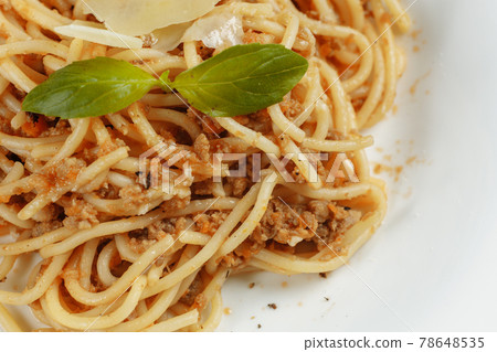 Spaghetti pasta with bolognese sauce and parmesan cheese, top view 78648535