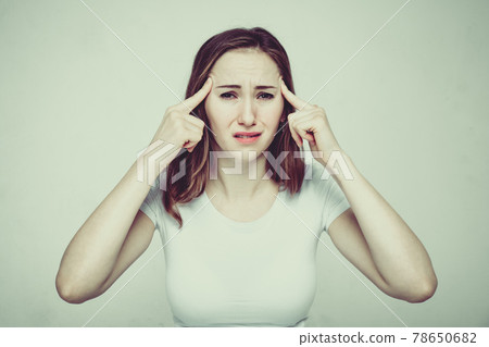 Portrait of a girl in a white T-shirt suffering from psychological pressure and criticism of society. Toned. 78650682