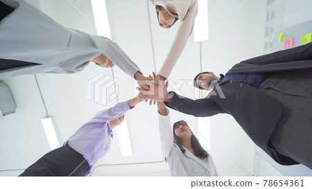Group of Asian successful business people stacking hands together to cheer up team together in meeting, communicate, discuss, and working with colleagues in office. People lifestyle.Corporate teamwork Group of Asian successful business people stacking hands together to cheer up team together in meeting, communicate, discuss, and working with colleagues in office. People lifestyle.Corporate teamwork 78654361
